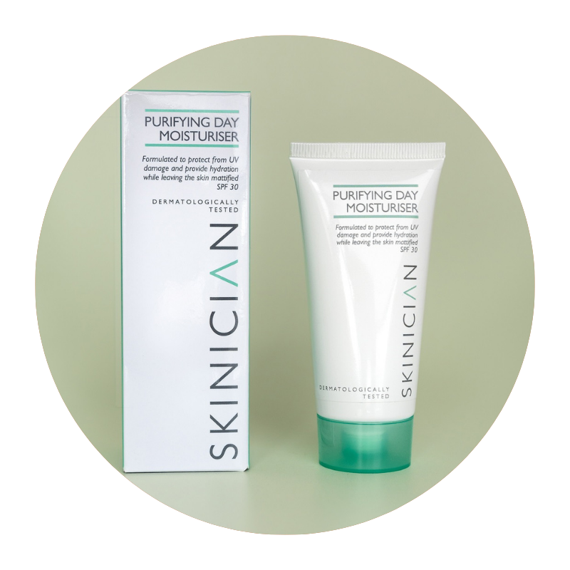 Round image of Skinician Purifying Day Moisturiser tube and outer box on a light green background