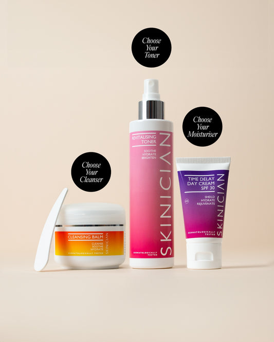 Skinician three-step skincare products on a beige background: Cleansing Balm (choose your cleanser), Revitalising Toner (choose your toner), and Time Delay Day Cream SPF 30 (choose your moisturiser)
