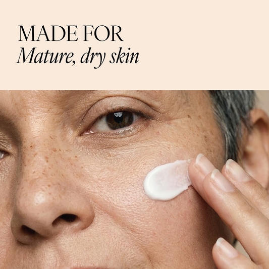 Woman applying Restoring Vitamin E Night Cream to her face, with text “Made for mature, dry skin”