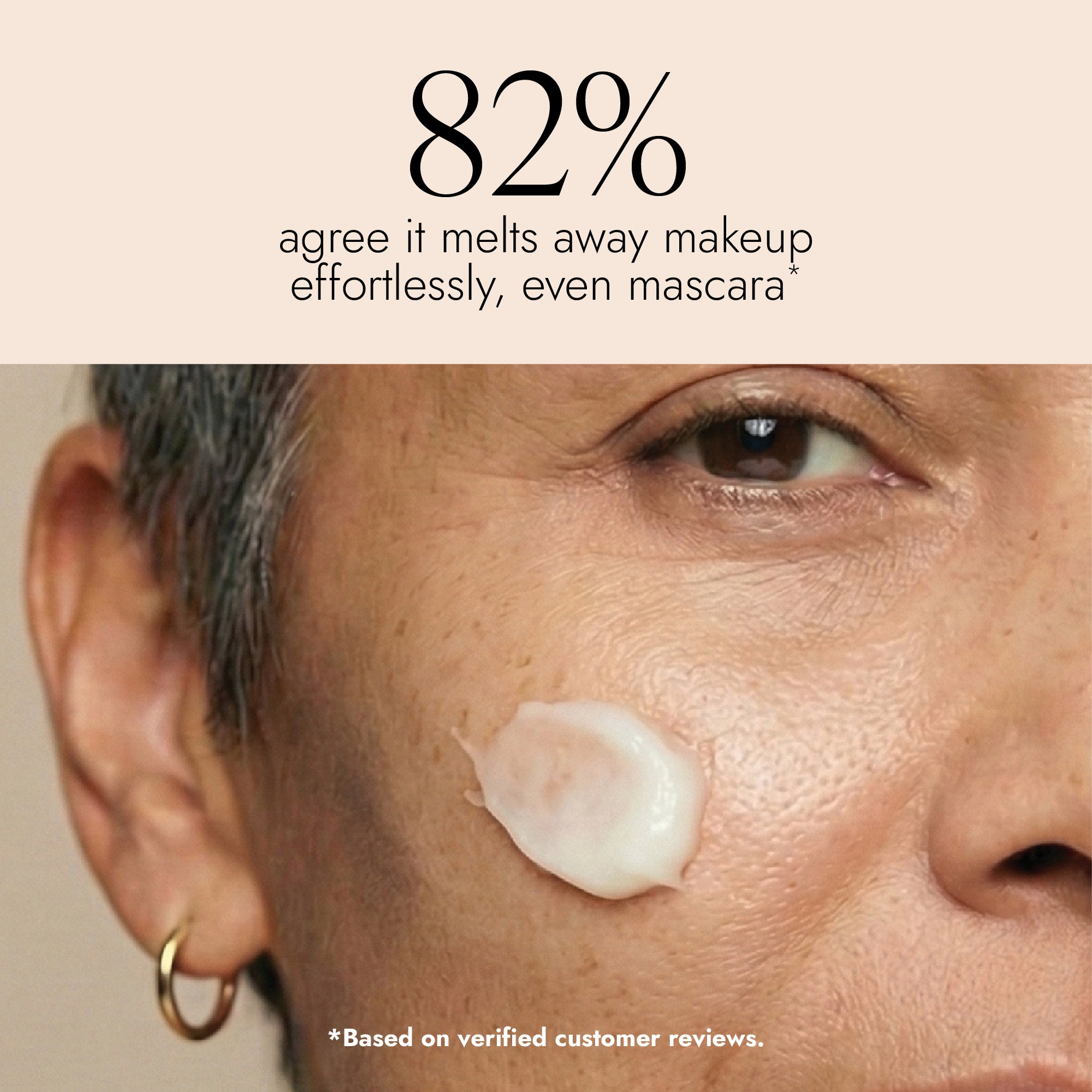 Close-up of a person's face with Cleansing Balm swiped across the cheek. Image features text that reads
