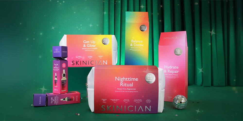 Skinician 2025 gift set collection of all curated skin care sets showcased on a green velvet christmas display background