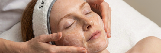 Close up of model wearing Skinician headband getting a facial