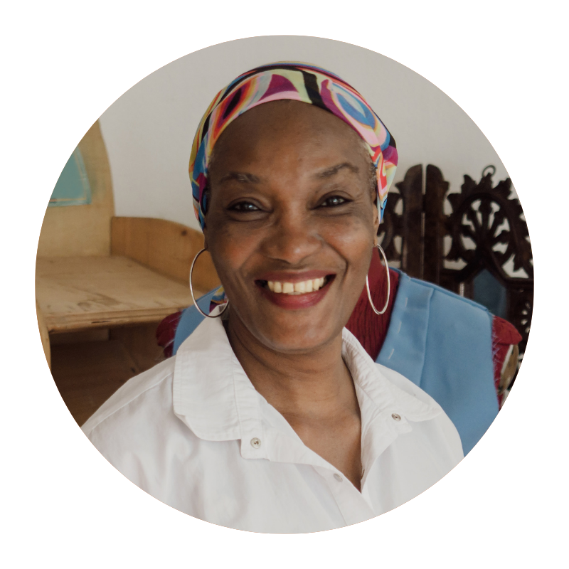 Round image of middle-aged woman smiling to represent Skinician customer