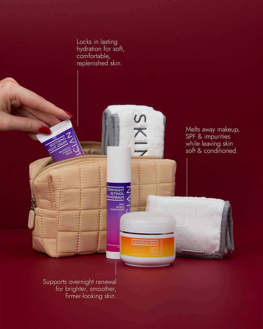 Image of Skinician skincare products contained in the Overnight Renewal Ritual Set arranged in front of a quilted cosmetic bag on a deep red background. White callout lines with text describe each product's benefits.
