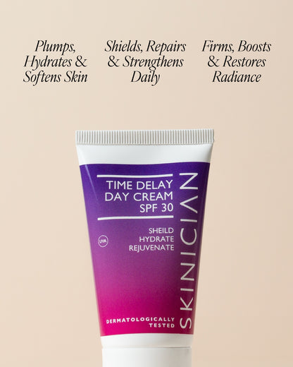 Tube of Skinician Time Delay Day Cream SPF 30 on a beige background with texture "plumps, hydrates & softens skin. Shields, repairs & strengthens daily. Firms, boosts & restores radiance"