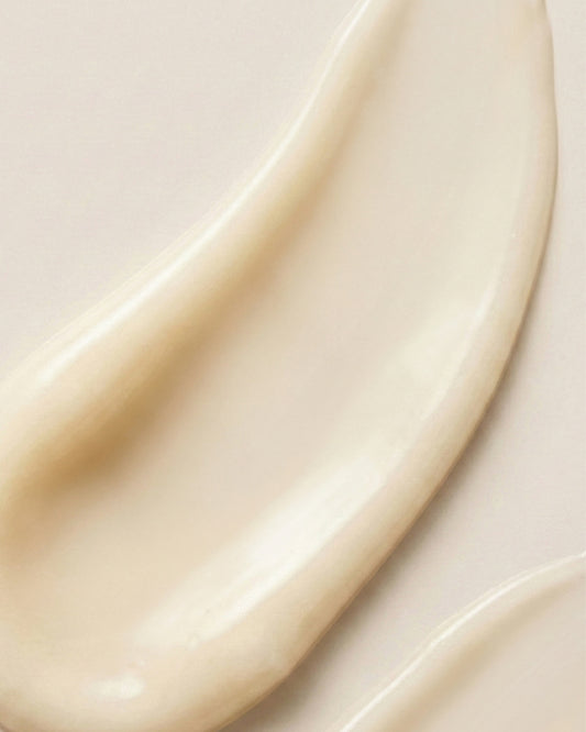 Close-up of smooth, cream texture of Pro-Radiance Enzyme Peel on a light background