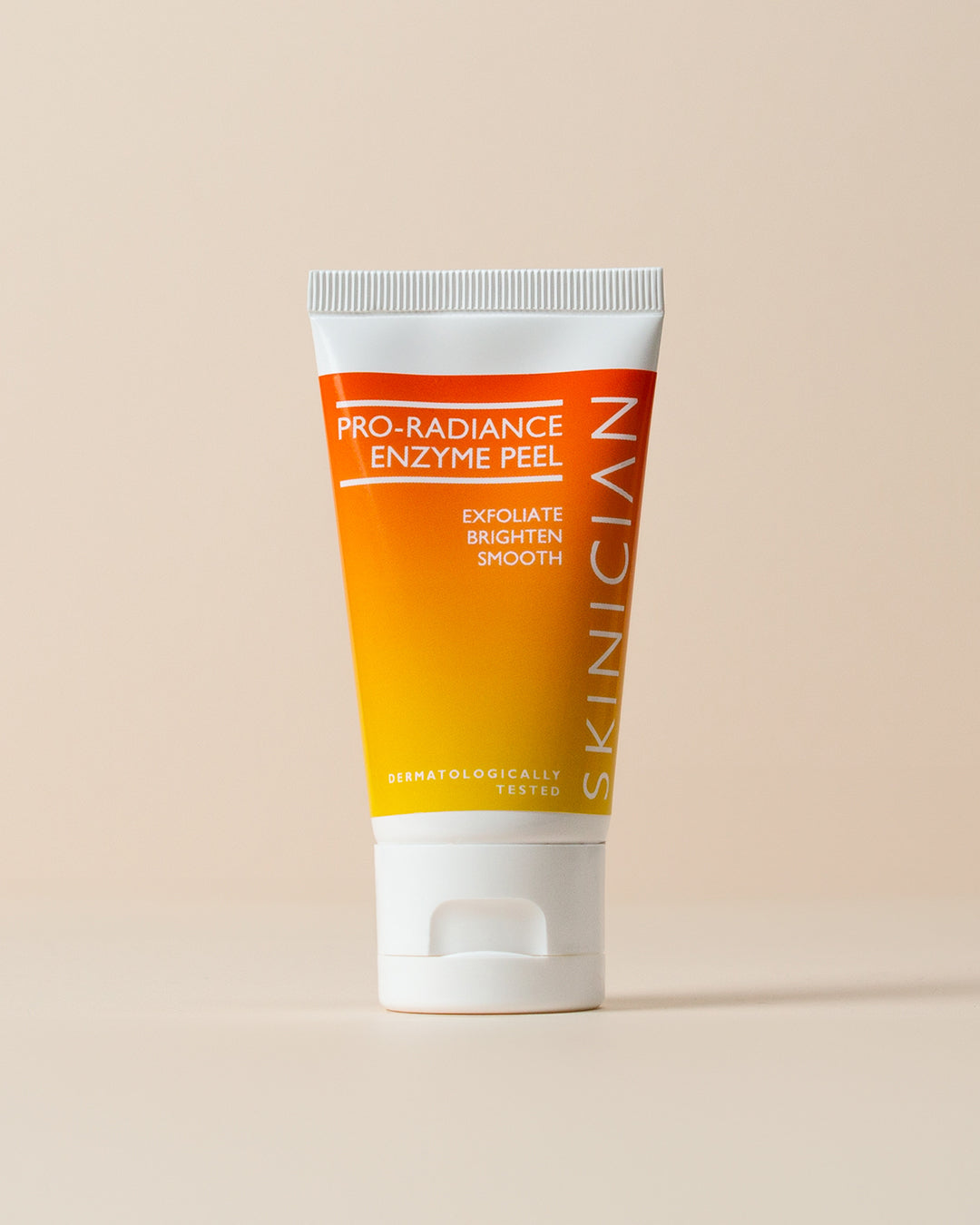Tube of Pro-Radiance Enzyme Peel by Skinician on a beige background