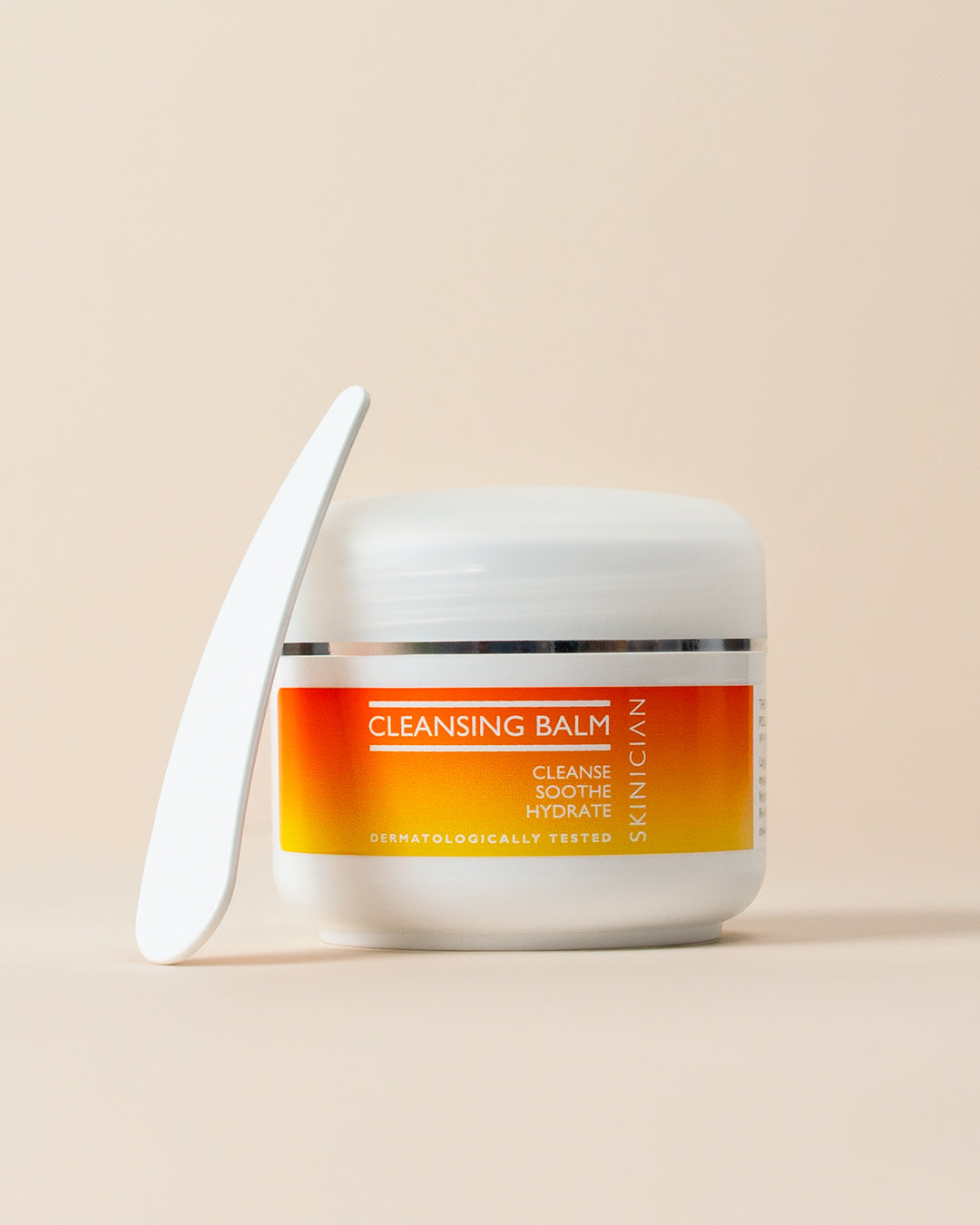 Cleansing balm jar on a beige background