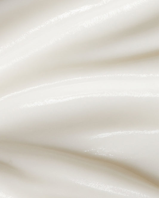 Close-up of smooth, white cream texture of Revitalising Cleanser