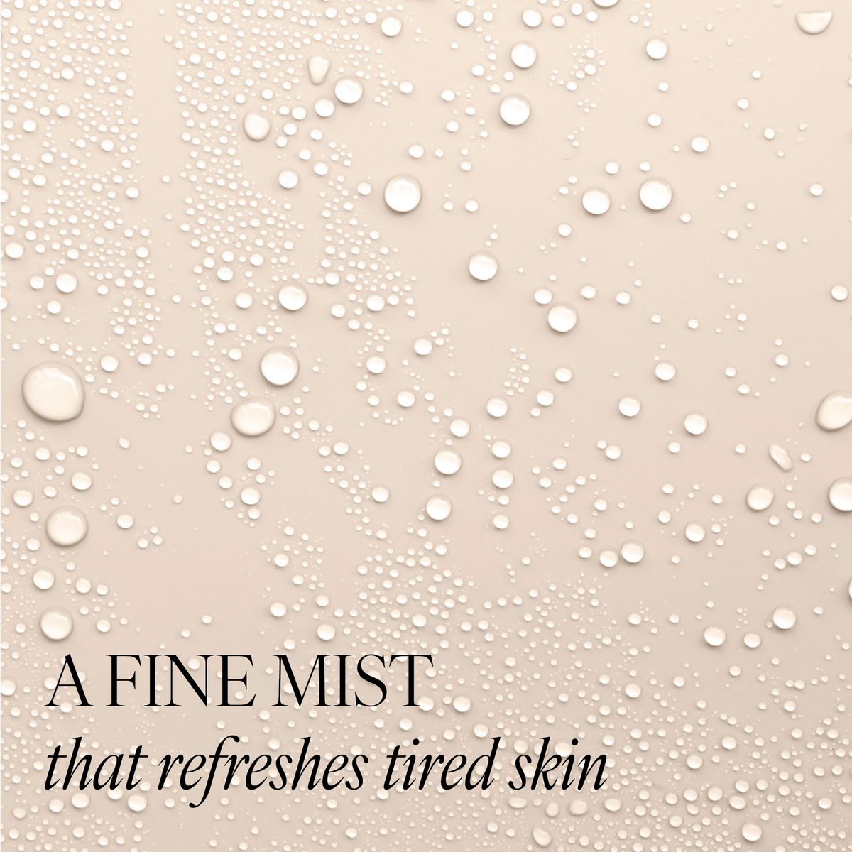 Beige background with water droplets to represent the texture of Revitalising Toner. Image features text "a fine mist that refreshes tired skin"