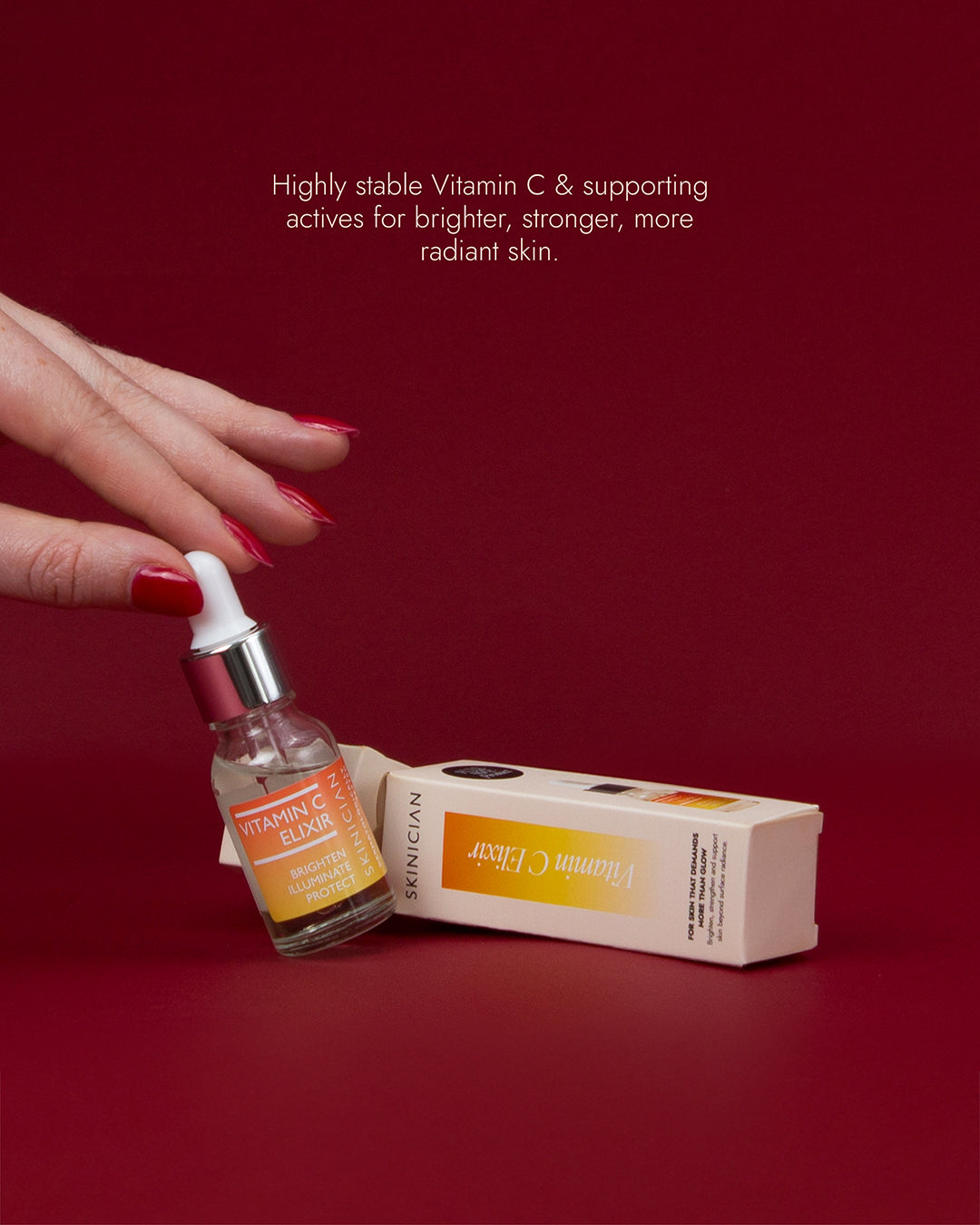 Image of hand holding Vitamin C Elixir in front of dark red background. Image features text 