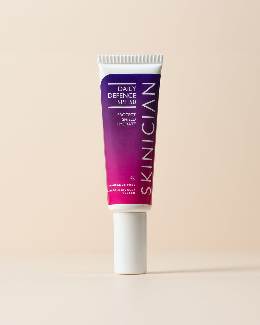 Tube of Skinician Daily Defence SPF 50 on a beige background