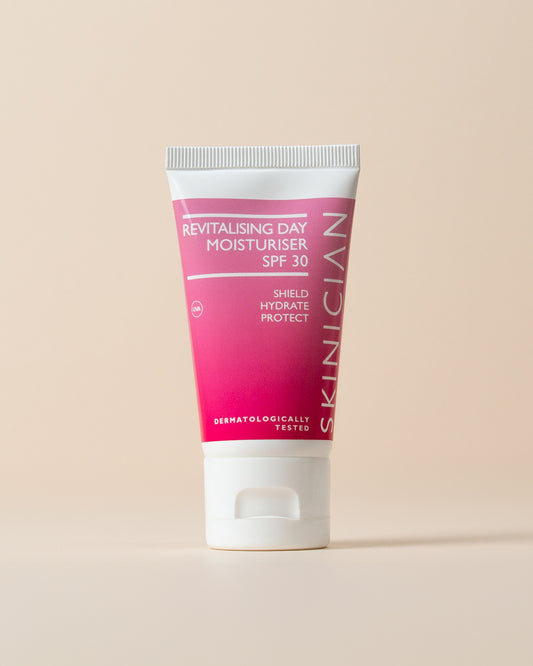 Revitalising Day Moisturiser SPF 30 by Skinician on a beige background