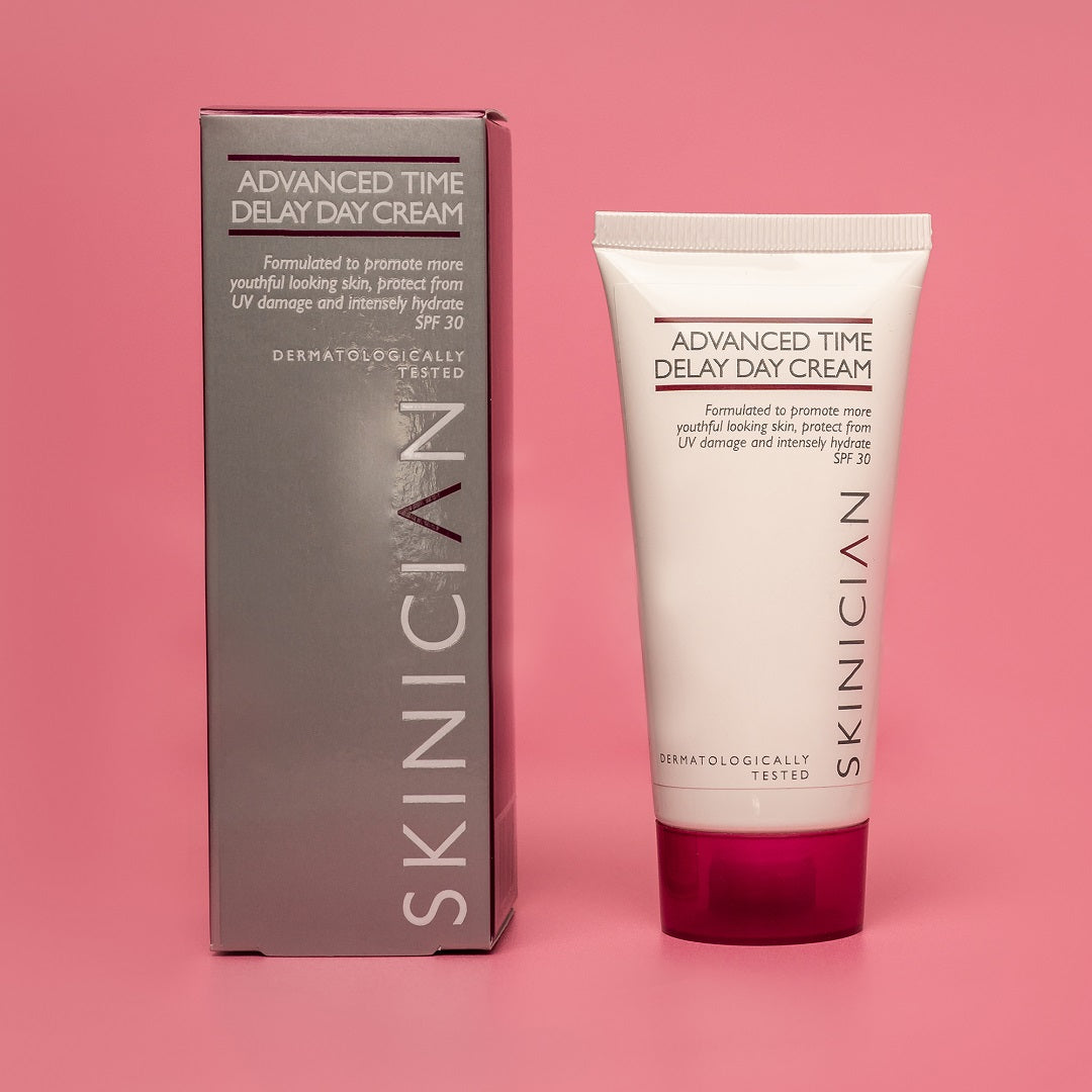 SKINICIAN day cream spf 30 image of carton and tube on a pink background
