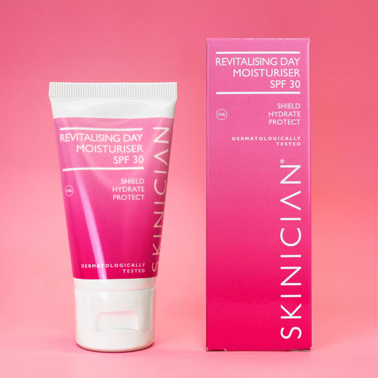 Image of SKINICIAN Revitalising Day Moisturiser SPF 30 tube and outer box on pink background