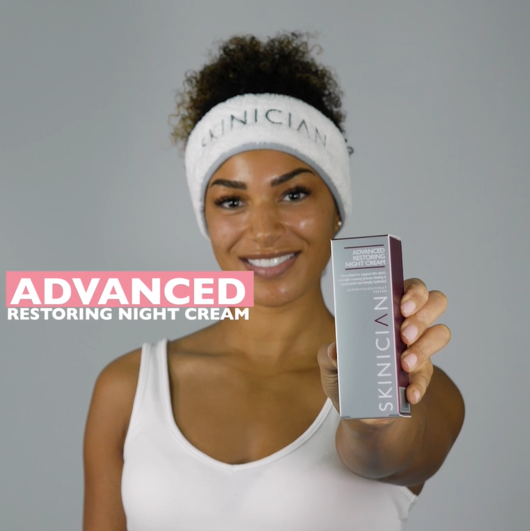 Youtube video of a lady removing the restoring skin cream from the tube and applying to her face.