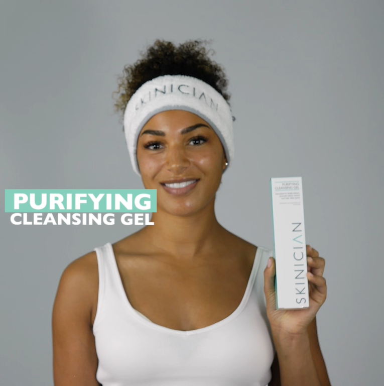 Youtube video of a lady unboxing the purifying face wash and applying to her face for cleansing.